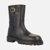 Botas negras de piel Agnes con tachas doradas en la puntera