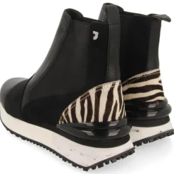 Botines negros chelsea con trasera de cebra Harbin