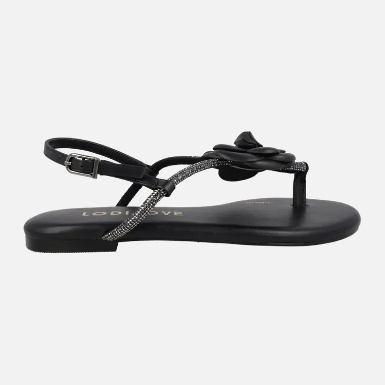 Sandalias planas negras de piel con adorno de flor y strass