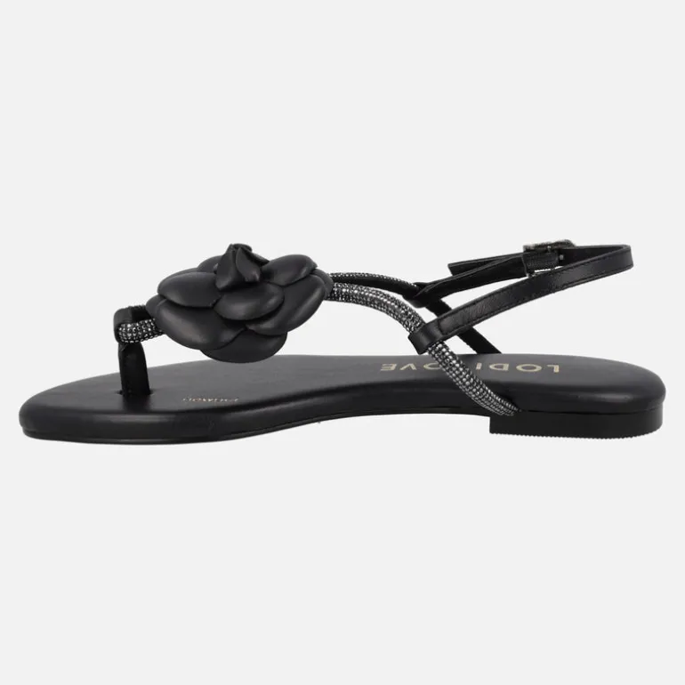 Sandalias planas negras de piel con adorno de flor y strass