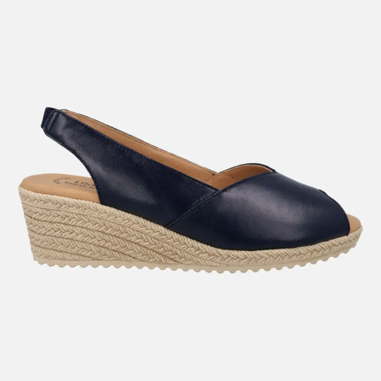 Zapatillas de piel destalonadas y abiertas de puntera con cuña media