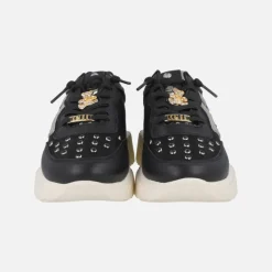 Zapatillas deportivas negras con adorno de oso dorado