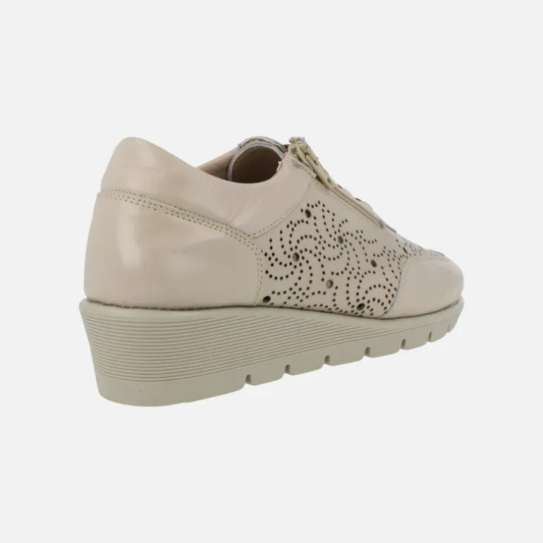 Zapatos deportivos de piel con dibujos troquelados
